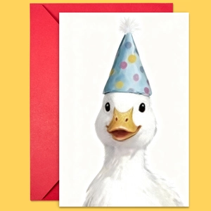 Close-up of cute white duck card with birthday hat and vibrant red envelope