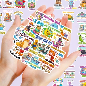 Close-up of hands holding a collection of funny cartoon animal stickers with text