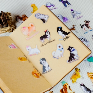 Close-up of waterproof PET dog stickers applied on a vintage kraft paper notebook