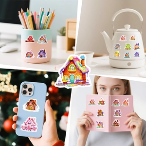 Macro view of candy house stickers applied on phone cases and laptop covers