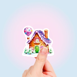 Detailed close-up of a colorful candy house sticker with candy canes and hot air balloon