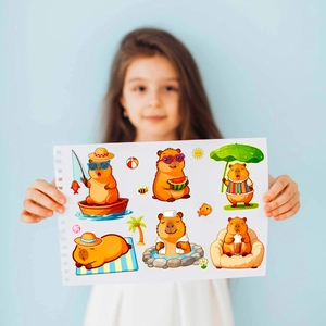 Detailed view of six cute capybara stickers depicting summer leisure activities for kids