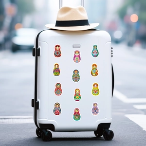 Close-up of colorful Russian matryoshka doll stickers on white luggage with sun hat detail