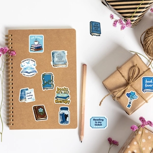 Blue vintage book lover stickers set on notebook with coffee and butterfly motifs