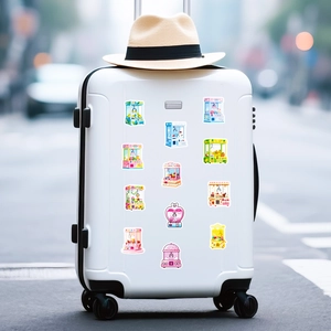 Macro detail of cute colorful claw machine stickers on white luggage for travel decoration