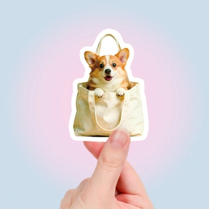 Close-up of a cute Corgi dog sticker in a canvas bag for planner and journal decoration