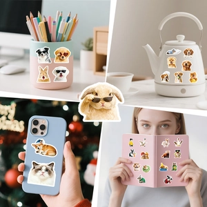 Various cute animal stickers on a phone case and notebook showing practical usage