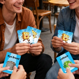 Detail of food-themed burger card game showing rye bread and lettuce interaction