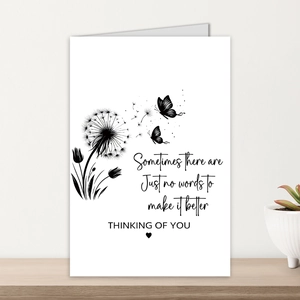 Detail of sympathy card with dandelion sketch and Thinking of You message on wood