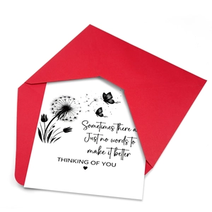 Funeral sympathy card set with dandelion motif and red envelope on white background