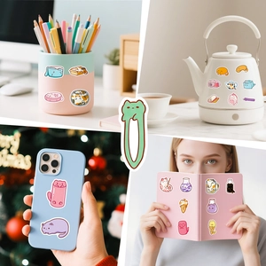 Close-up of cute cartoon cat stickers applied to coffee pots and mobile phone cases