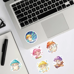Detail shot of cute anthropomorphic mushroom stickers on a laptop and notebook surface