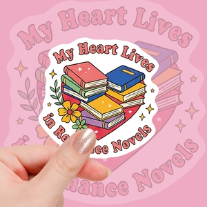 Detail of pink romance novel stickers with heart shape book stack design and text