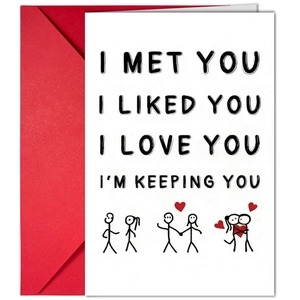 Close-up of anniversary greeting card with matchstick figures and red envelope