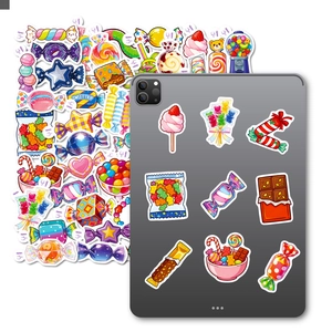 Detail of colorful cartoon candy stickers decorating the back of a tablet device
