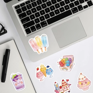 Close-up of summer dessert stickers on laptop and notebook for creative decoration