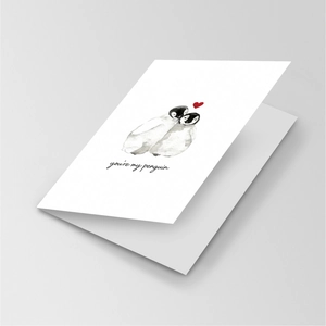 Close-up of a white fold-out card with cute penguins and You're My Penguin text