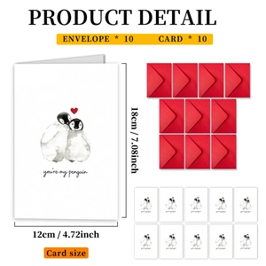 Detail view of 10 penguin cards and 10 red envelopes with specific size measurements