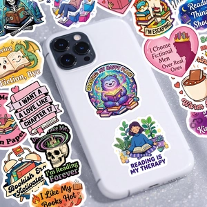 Close-up of pink bookish stickers with reading quotes applied on a white smartphone