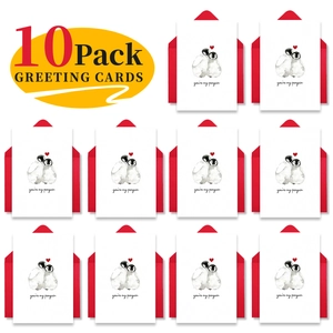 Close-up of 10 pack romantic penguin greeting cards with red envelopes for couples