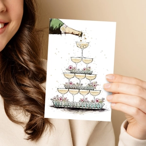 Artistic watercolor wedding card showing a champagne tower held by a hand