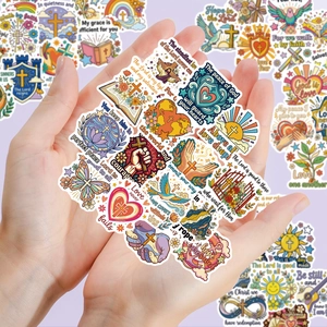 Close-up of hands holding assorted Christian Bible journaling stickers with diverse motifs