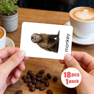 Close-up of animal flashcard showing a monkey with bilingual text for early education