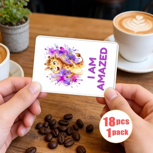 Close-up of watercolor giraffe emotion card with I AM AMAZED text held by hands