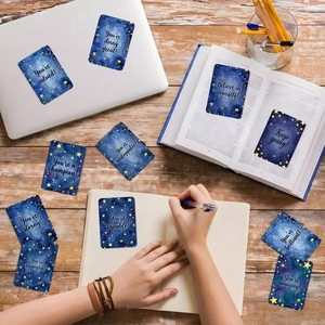 Starry sky inspirational cards with motivational English quotes on wooden desk
