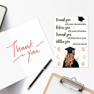 Close-up of graduation card with motivational message and Thank You script on clipboard