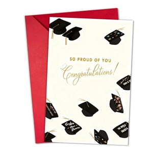 Graduation card detail with graduation caps and So Proud of You text on a red envelope