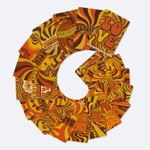 Close-up of 70s psychedelic vintage greeting cards with bold warm colors and retro typography