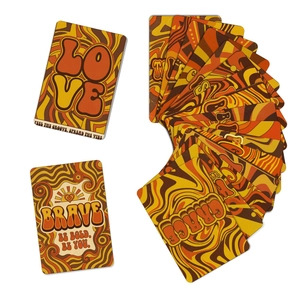 Macro view of retro 70s style thank you cards with orange and yellow wavy patterns