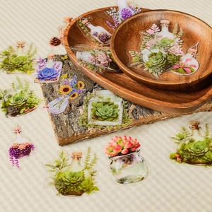 Detail of transparent PET botanical stickers featuring hand-painted floral glass jars