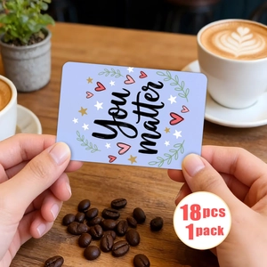 Detail of 18 motivational cards with 'You matter' text held over a cozy coffee background