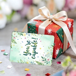 Floral watercolor encouragement card with You are capable text on a festive gift box