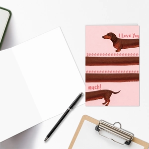 Close-up of cute dachshund greeting card with 'I Love You' text and matching stationery