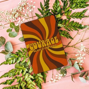 Close-up of retro orange thank you card with COURAGE text and floral greenery