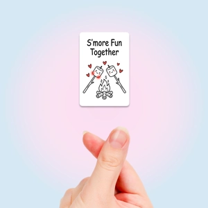 Detail showing S'more Fun Together cartoon card with cute marshmallow bonfire illustration