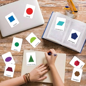 Educational bilingual geometric shape flashcards for kids learning on a wooden desk
