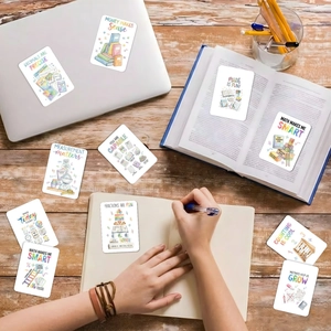 Close-up of colorful educational math stickers with motivational quotes on a wooden desk