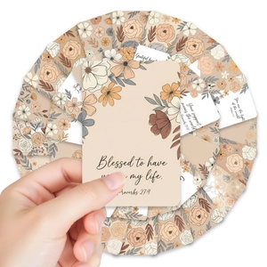 Close-up of floral inspirational cards with bible verses in a radial layout