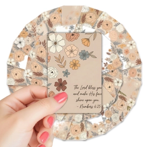 Close-up of hand holding vintage floral card with English inspirational bible verses