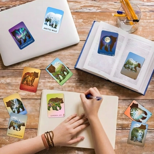 Artistic bear silhouette nature stickers featuring fantasy landscapes on office desk