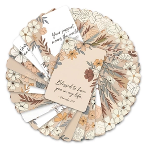 Detailed overhead view of stacked vintage floral greeting cards with inspirational quotes