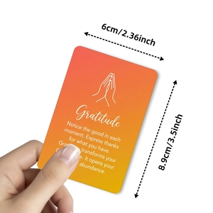 Hand holding orange gradient Gratitude quote card for emotional healing and gifting
