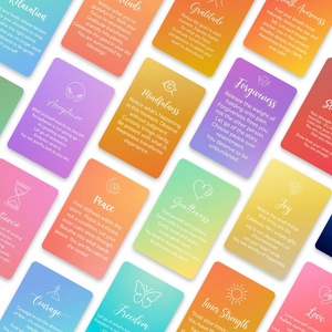 Macro shot of 18 rainbow gradient mindfulness cards with positive healing quotes