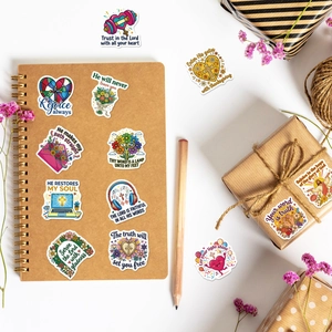 Bible verse stickers on notebook and gift box with floral motifs and pencils