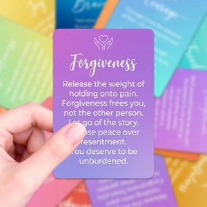 Detail of a purple gradient forgiveness card with text from an emotional healing set