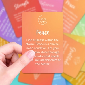 Close-up of a peace affirmation card with rainbow gradients and elegant lotus logo